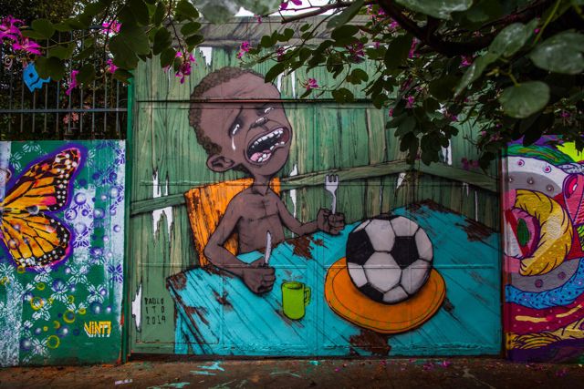 Graffiti on a wall of a public school criticizes the hosting of the World Cup